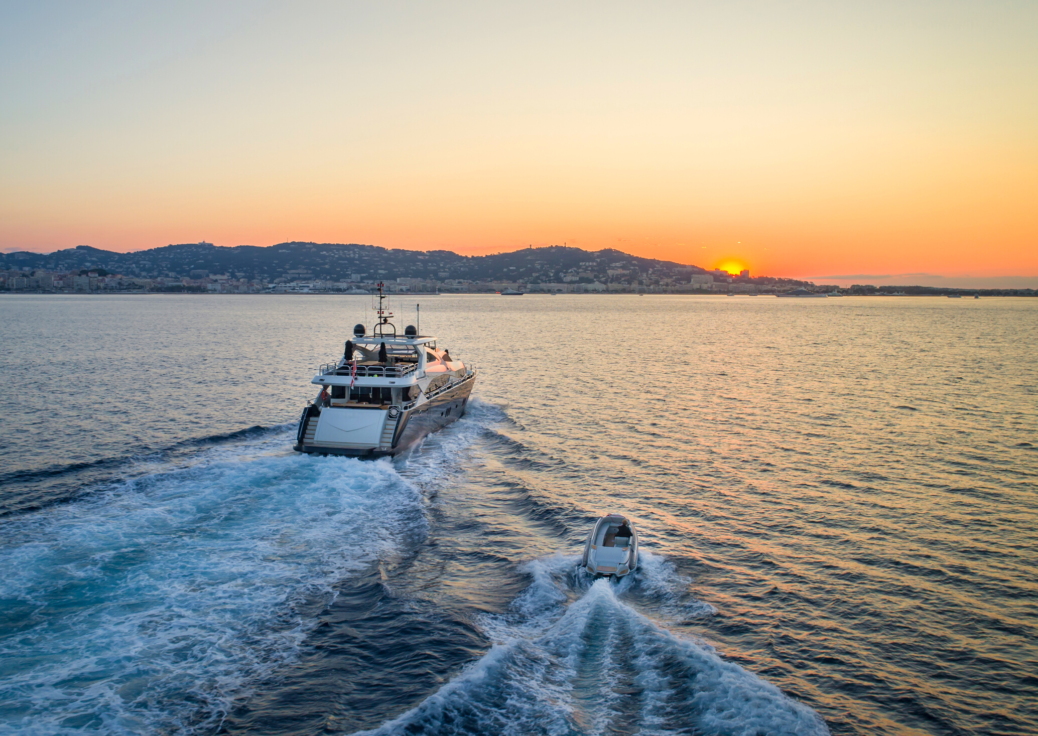 A Super Yacht Motoring at Sunset